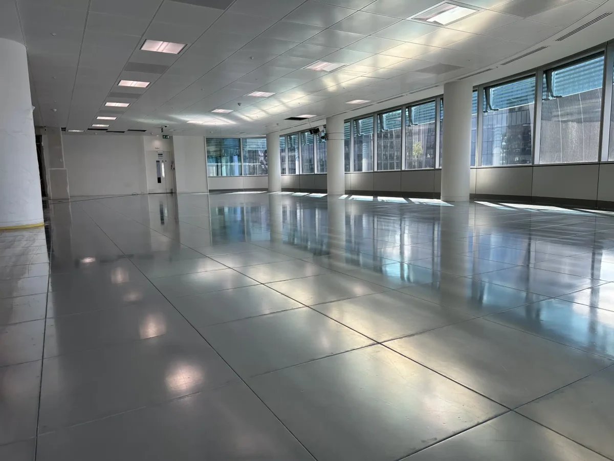 Restored raised access floor panels clean and ready for reuse in commercial office space