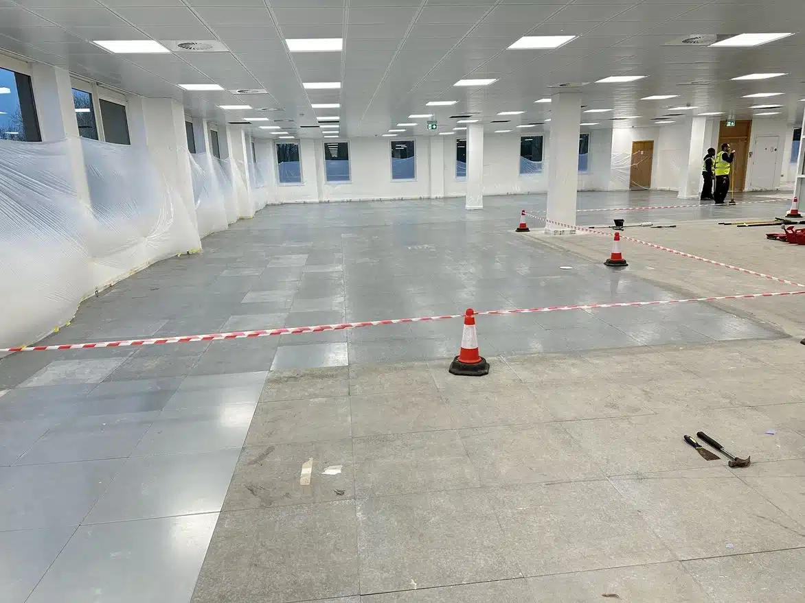 Protective covers applied to walls and surfaces before starting raised access floor restoration