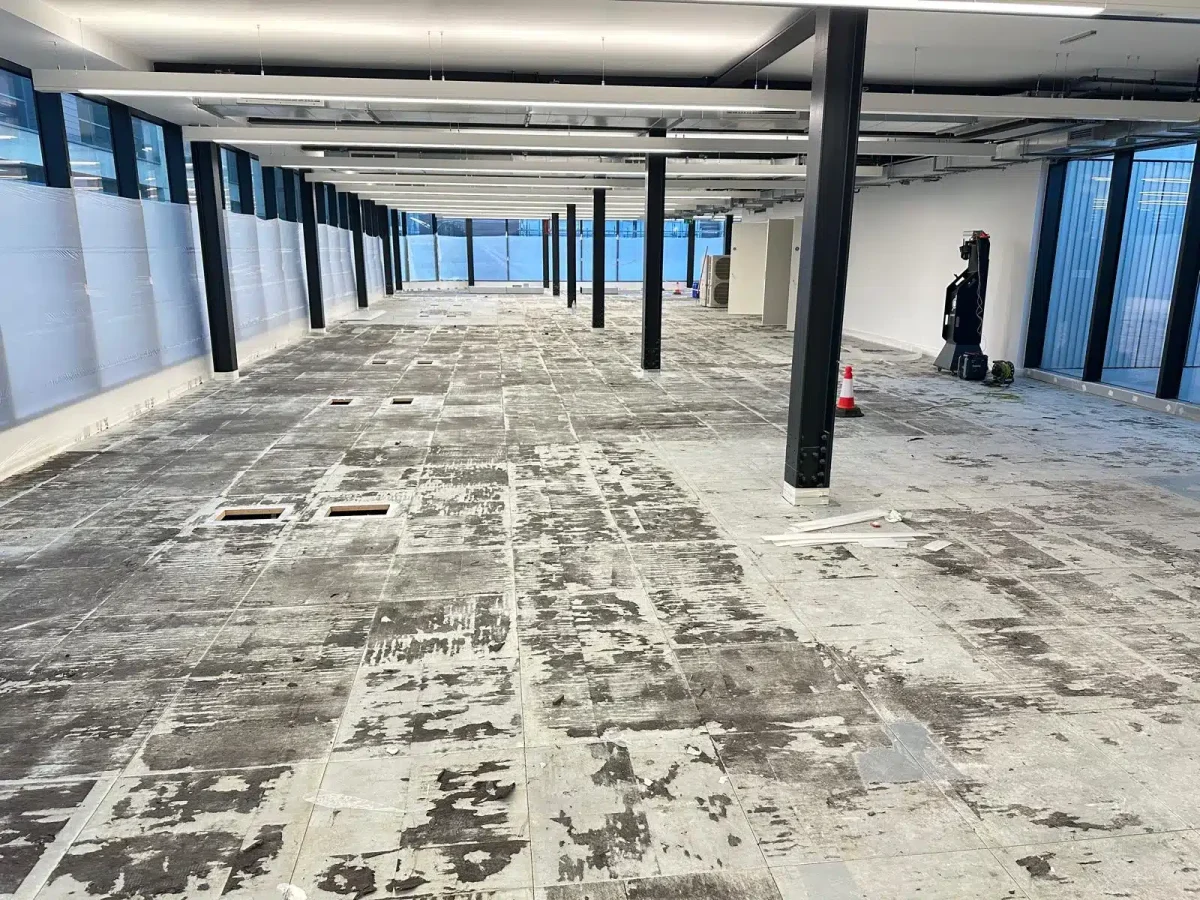 Before Professionally finished raised access floor panels after complete refurbishment in commercial property