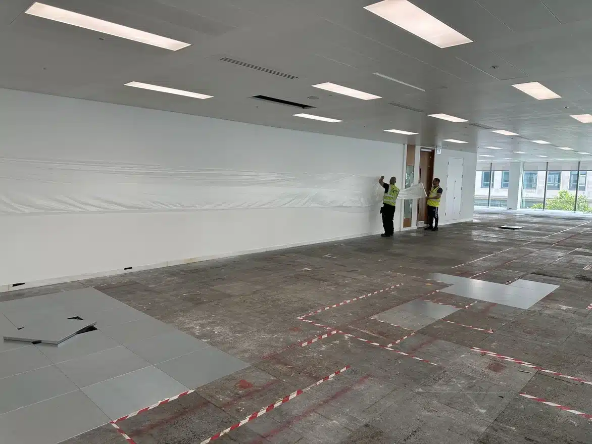Protecting office environment and fixtures before raised floor refurbishment and adhesive removal